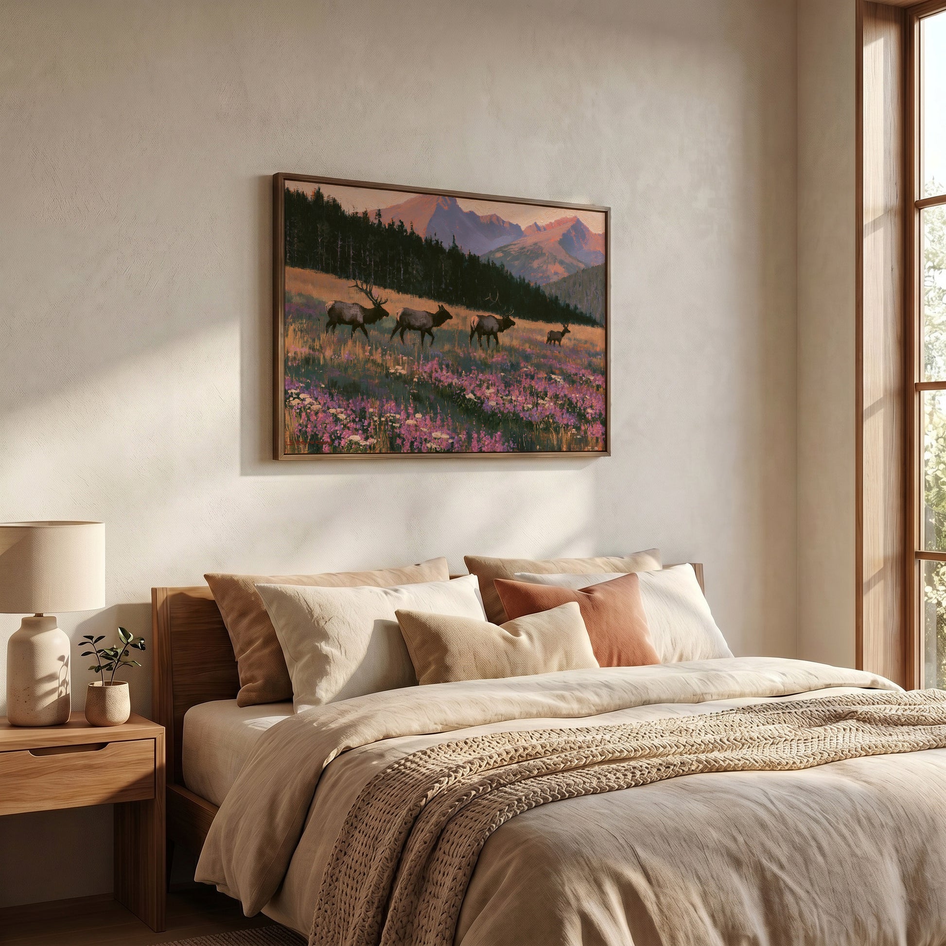 a serene bedroom scene with a large bed, a nightstand, and a framed landscape painting of a field with deer in the background.