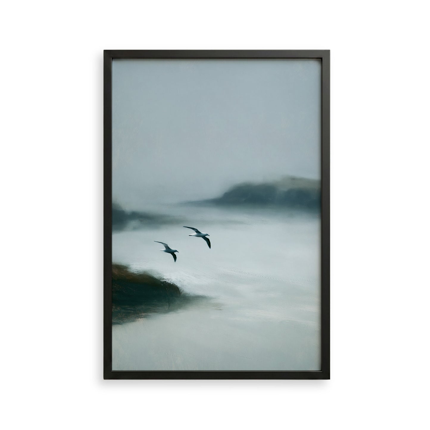 two birds flying over a misty, foggy landscape.