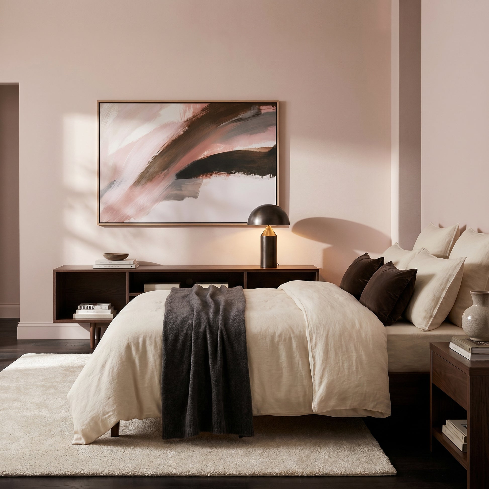 a serene and modern bedroom with a large bed, a wooden nightstand, and a framed abstract painting on the wall.