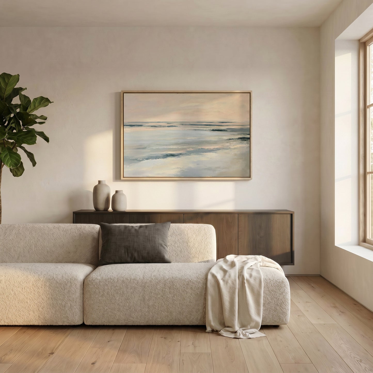 a serene living room with a large window, a white sofa, a wooden cabinet, and a framed painting of a tranquil ocean scene.