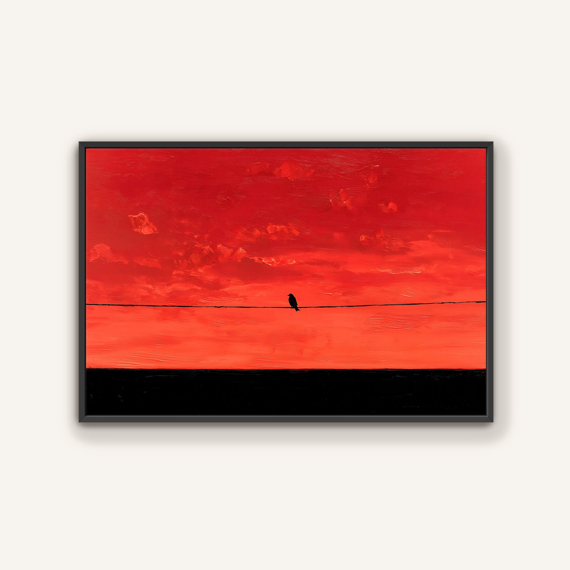 A lone bird perched on a wire against a vibrant red and orange sky.