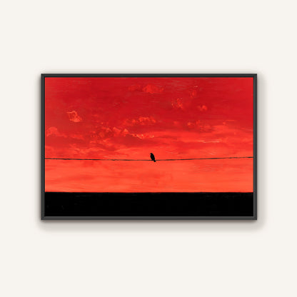 A lone bird perched on a wire against a vibrant red and orange sky.