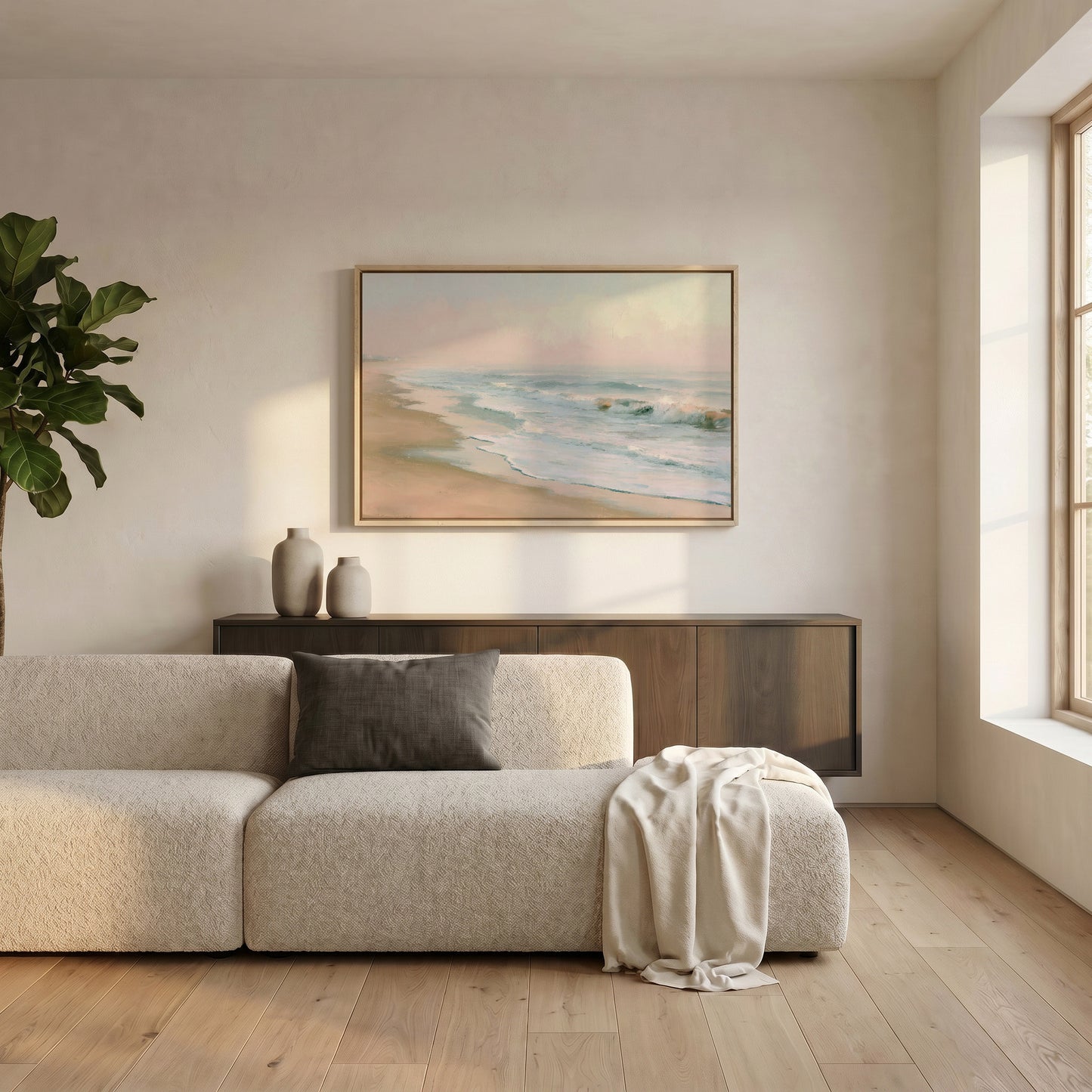 a serene living room with a large window, a white sofa, a wooden cabinet, and a framed painting of a beach scene hanging on the wall.