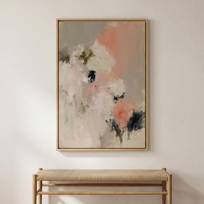 a large abstract painting hanging on a white wall above a wooden bench.