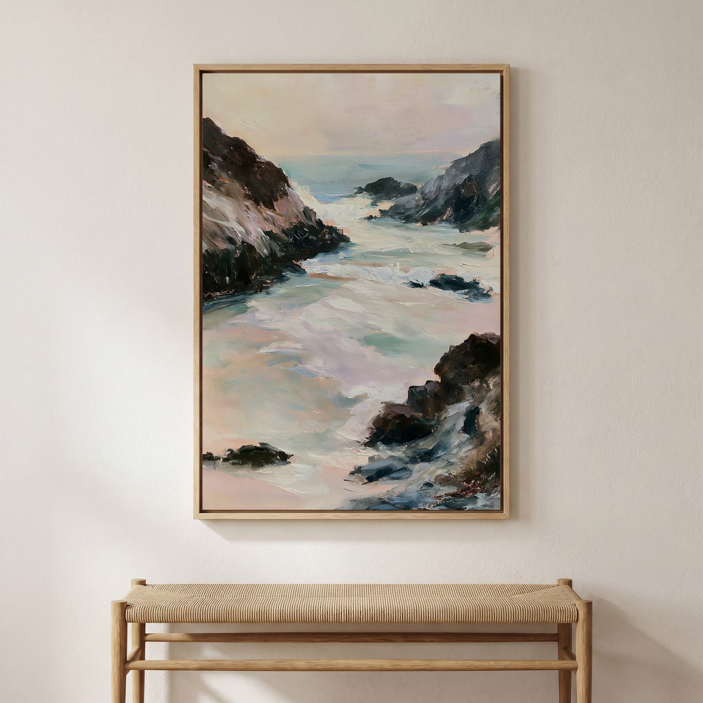 a large painting of a serene landscape with a river, mountains, and a sky with clouds. The painting is hung on a wall above a wooden bench.