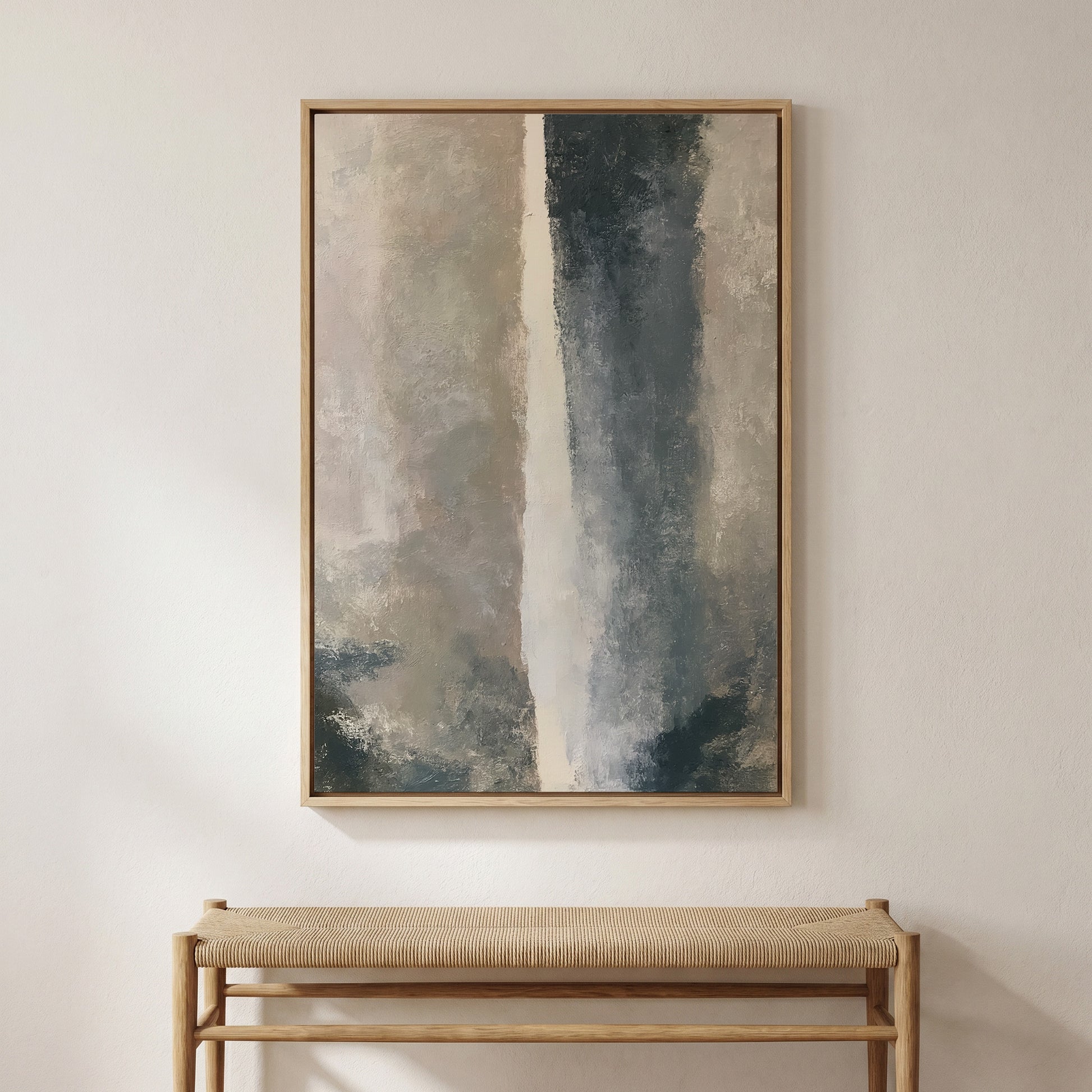 a large abstract painting hanging on a white wall above a wooden bench.