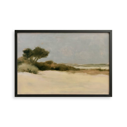 The image is a framed painting depicting a serene landscape with a sandy beach, trees, and a hazy sky.