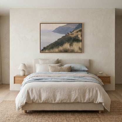 a serene bedroom setting with a large bed, a wooden nightstand, and a framed landscape painting hanging above the bed.