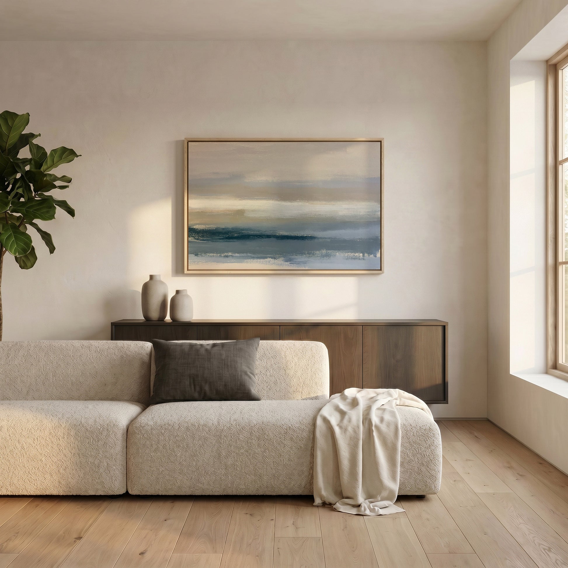 a modern living room with a large window, a white sofa, a wooden cabinet, and a framed landscape painting on the wall.