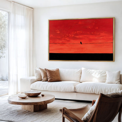 a modern living room with a large red abstract painting hanging on the wall above a white sofa. The room has a wooden coffee table in front of the sofa, and a brown leather chair is placed nearby.