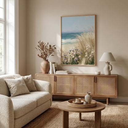 a cozy living room with a large window, a beige sofa, a wooden sideboard, a coffee table, and a framed painting of a beach scene.