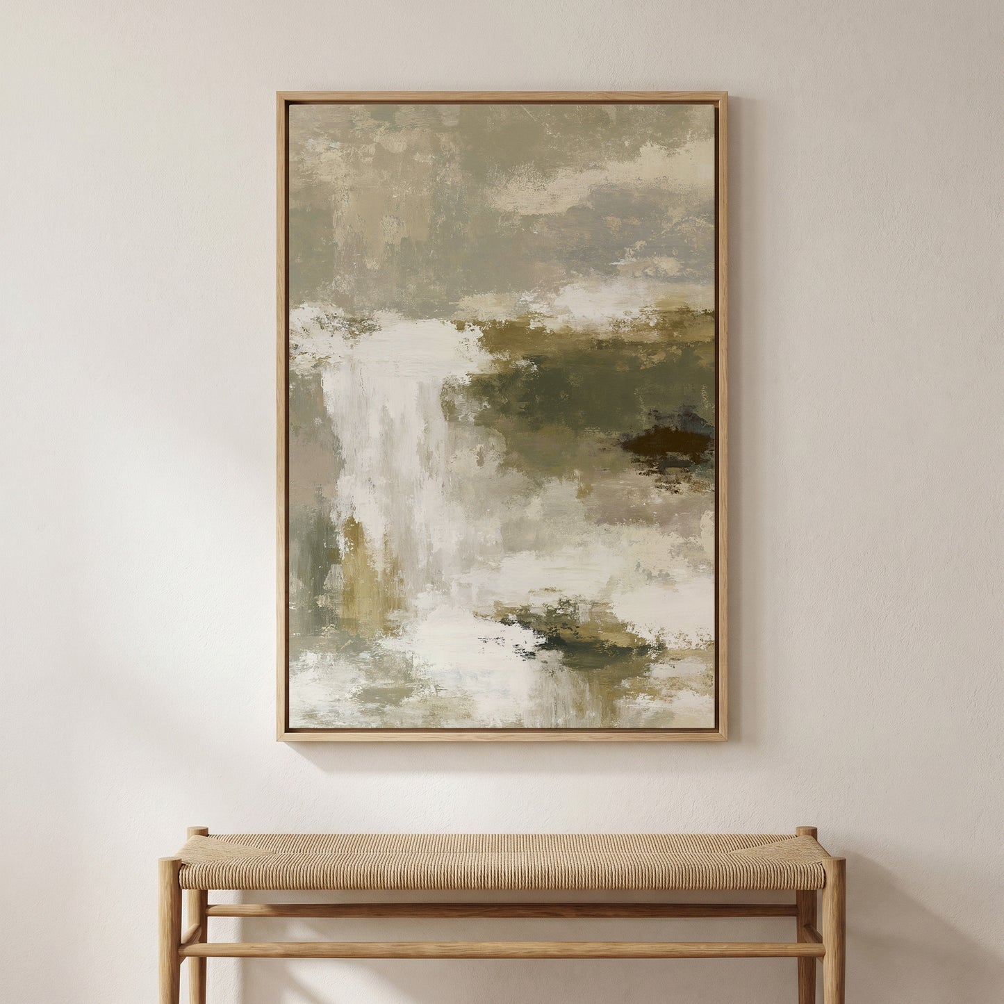 a large abstract painting hanging on a white wall above a wooden bench.