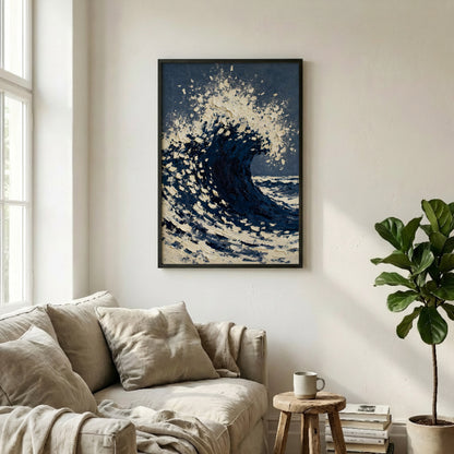 a cozy living room with a large framed painting of a crashing wave hanging on the wall above a beige sofa. The painting is framed in black and has a blue and white color scheme. The room also features a potted plant, a coffee table, and some books, creating a comfortable and inviting atmosphere.