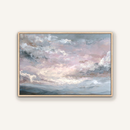 Soft pastel pink and gray cloud artwork in a light wood frame.