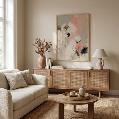 a cozy living room with a beige sofa, a wooden sideboard, and a large abstract painting on the wall.
