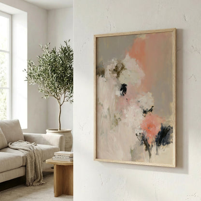 a living room with a large abstract painting hanging on the wall, a sofa, a potted plant, and a wooden coffee table.