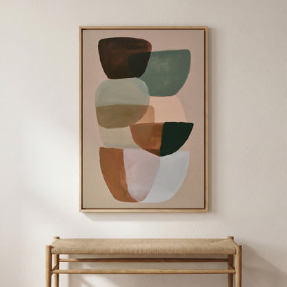 a large abstract painting hanging on a wall above a wooden bench.