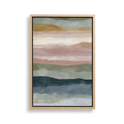 The image is a framed abstract painting with a gradient of colors, including shades of green, blue, and pink. The painting is displayed on a white wall.
