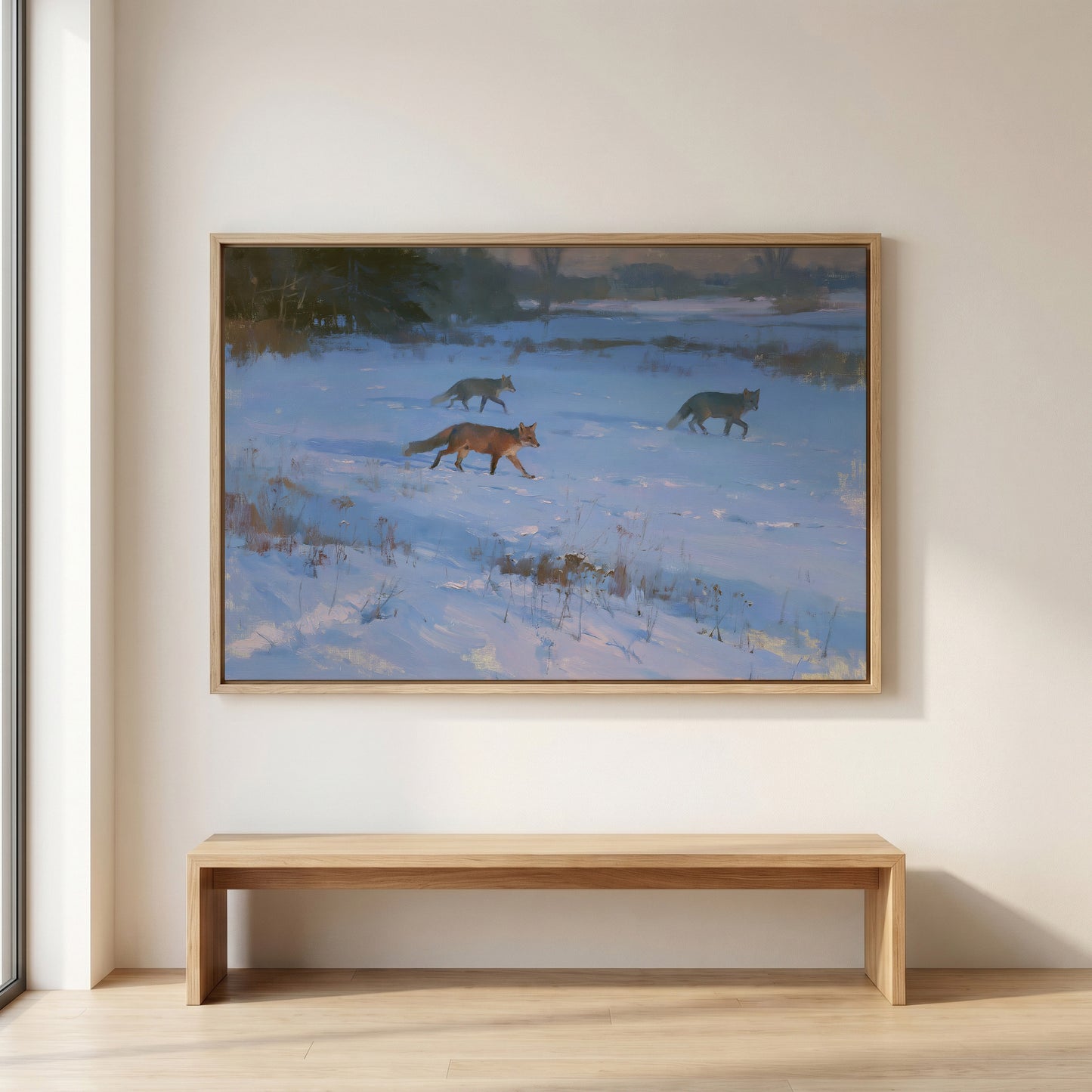 a snowy landscape with three foxes walking across the snow-covered ground.