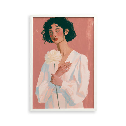 A woman with dark hair is holding a large white flower in the image.