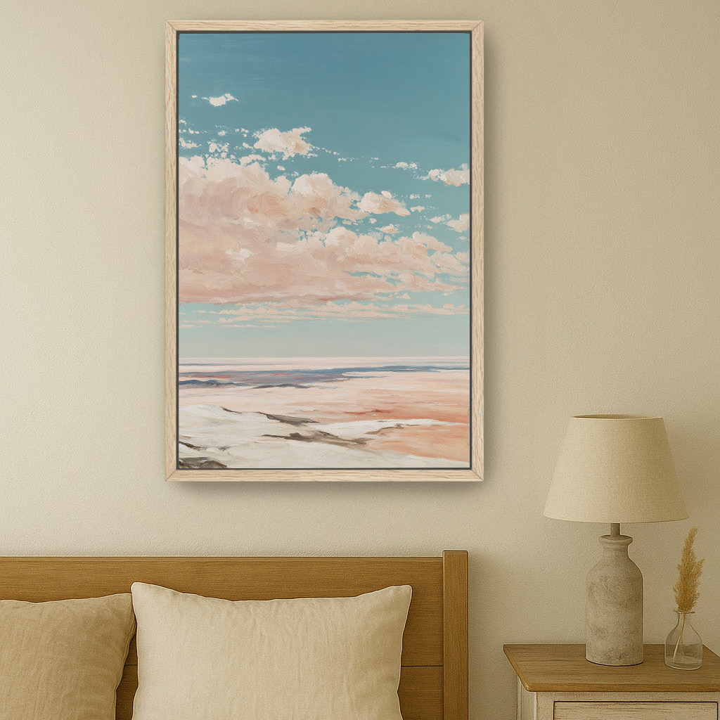 a serene bedroom scene with a large framed painting of a cloudy sky hanging above a bed with a wooden headboard. The painting depicts a tranquil landscape with a blue sky and fluffy white clouds. The bed is adorned with two white pillows and a beige comforter, creating a cozy and inviting atmosphere. A nightstand with a lamp is situated next to the bed, providing a source of light for reading or relaxation.