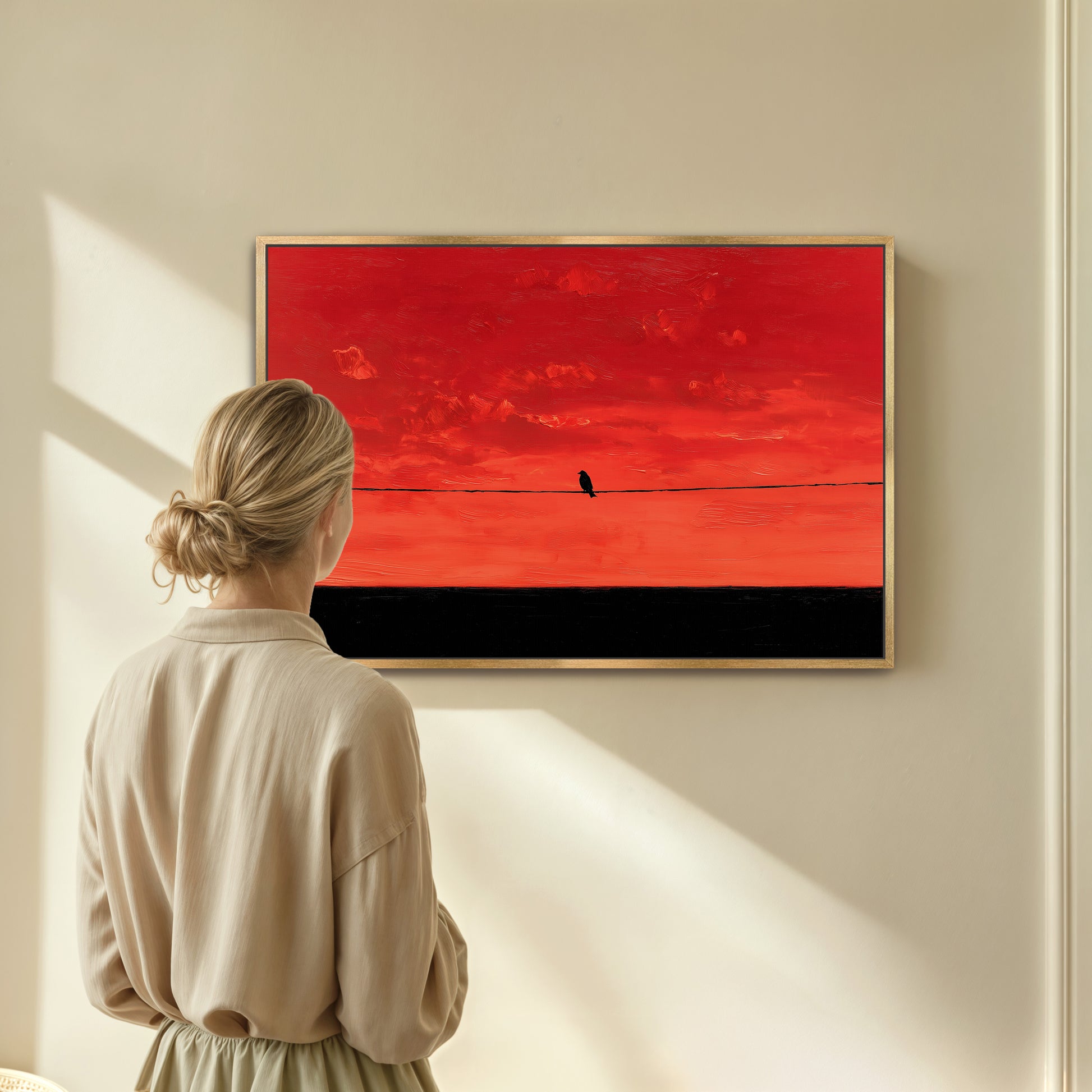 A woman stands in front of a large painting, gazing at it with a contemplative expression.