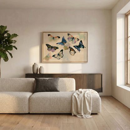 a cozy living room with a large, colorful painting of butterflies hanging on the wall above a beige sofa. The sofa is adorned with a gray throw blanket and a white throw pillow. The room also features a wooden floor, a potted plant, and a wooden cabinet or sideboard.