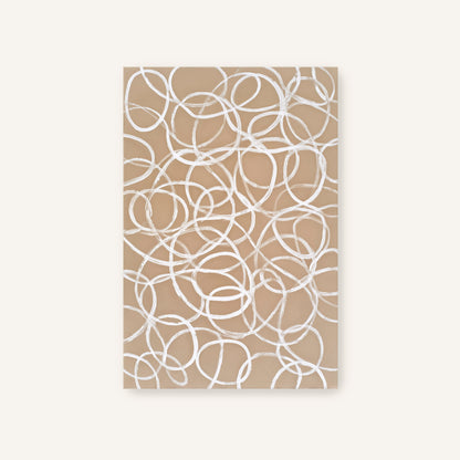 a repeating pattern of white circles on a beige background.
