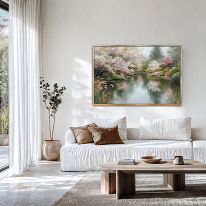a serene living room with a large painting of a tranquil pond and lush trees hanging on the wall. The room is decorated with white furniture, including a sofa and a coffee table, and features a large window that allows natural light to fill the space.