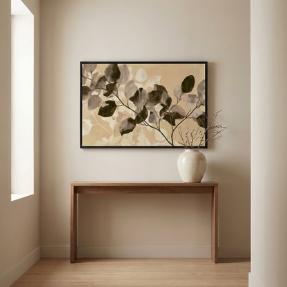 a wooden console table with a white vase on top, set against a wall with a framed painting of leaves hanging above it.