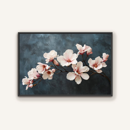 Magnolia branch floral wall art with ivory and blush flowers in black frame.