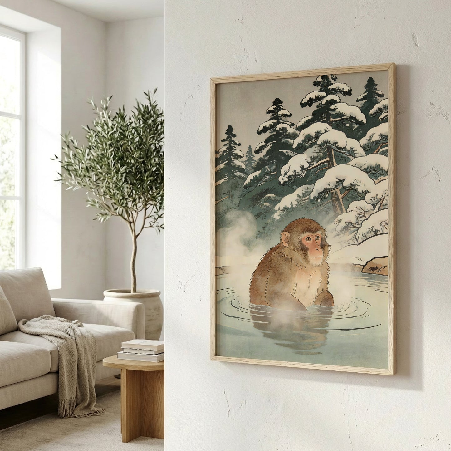 Snow monkey wall art in natural frame on angled wall in bright living room