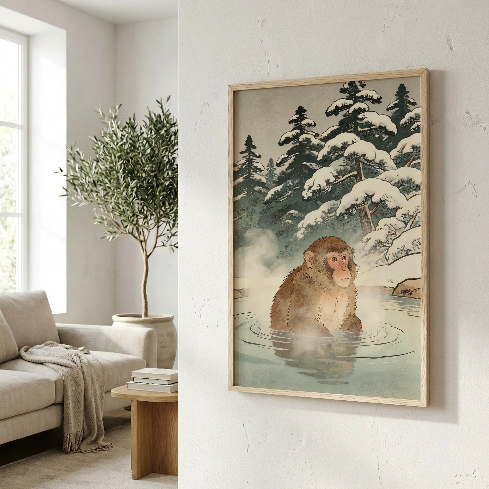 Snow monkey wall art in natural frame on angled wall in bright living room