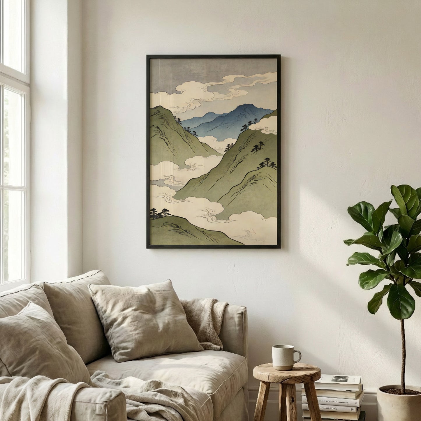 Japanese mountain landscape art print in black frame above beige sofa in minimalist living room with neutral decor
