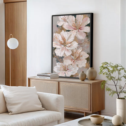 Abstract lily blossom artwork in a black frame displayed above a wooden console in a minimalist living room.