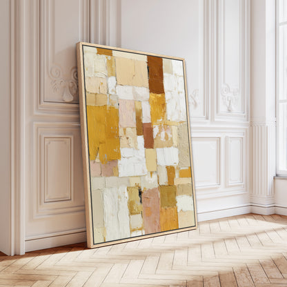 Large luxury abstract canvas with golden yellow and neutral brushstrokes leaning on wall