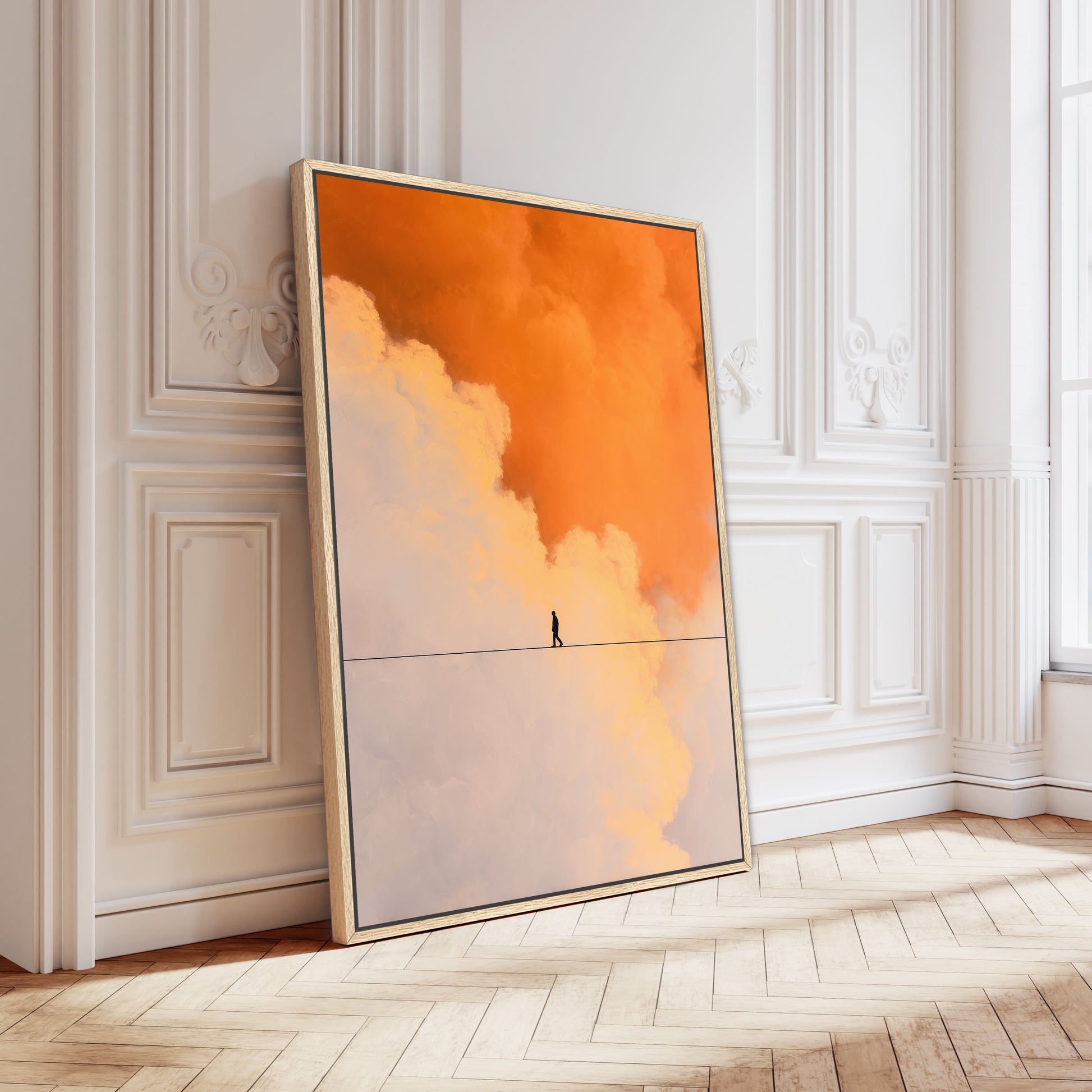 Elegant white room with herringbone floors featuring large orange and cream abstract cloud artwork framed in gold leaning on wall.
