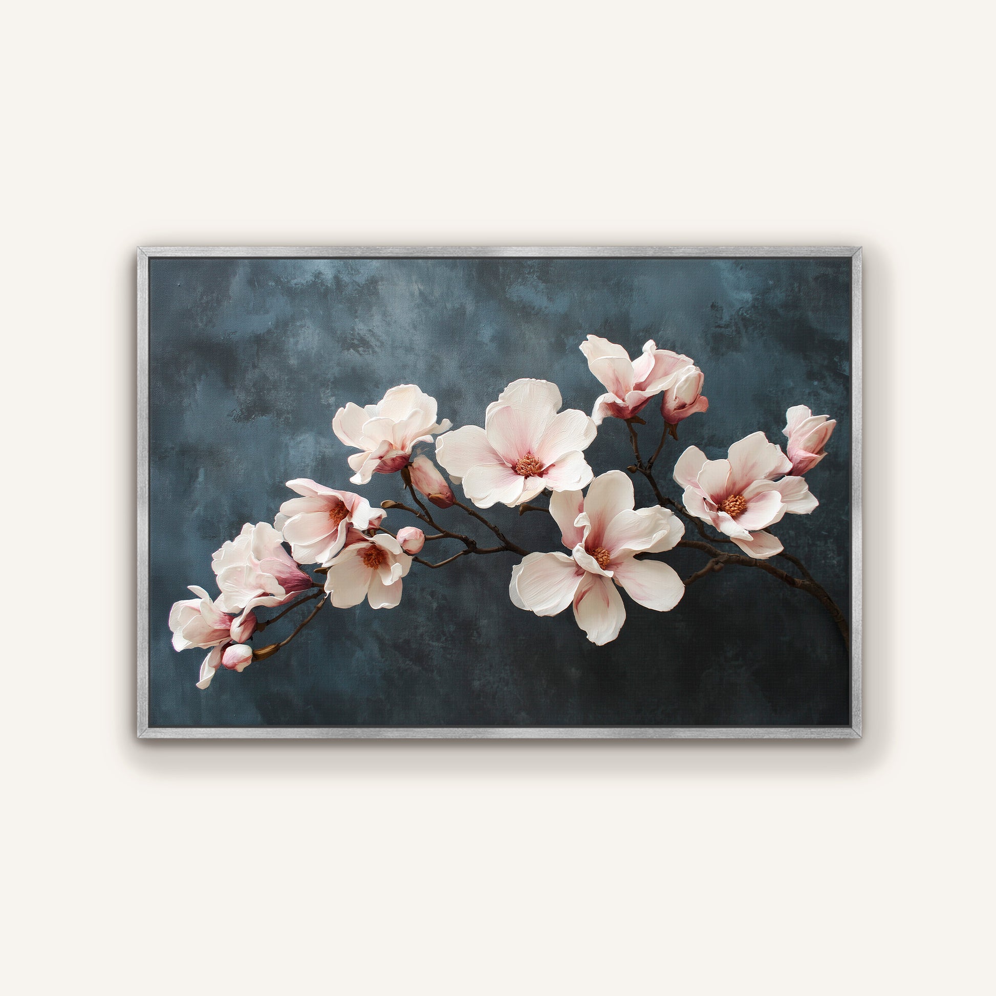 Magnolia floral canvas in silver frame with elegant ivory and blush flowers.