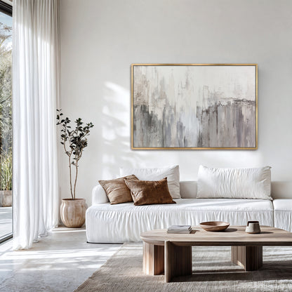 Neutral abstract wall art above sofa with bright natural light