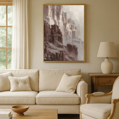Neutral living room with large canyon cliff wall art in a gold frame above a beige sofa.