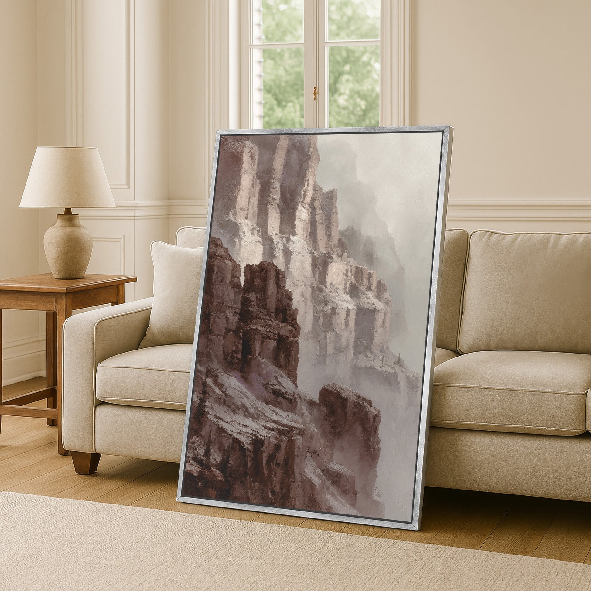 Large canyon cliff wall art leaning on wall in silver frame in classic white interior