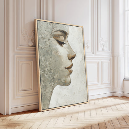 Oak-framed minimalist portrait leaning against white ornate Parisian wall in bright natural light interior.