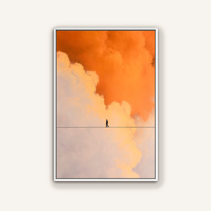 Minimal surreal wall art featuring a person walking between orange and pale clouds on a white framed canvas.