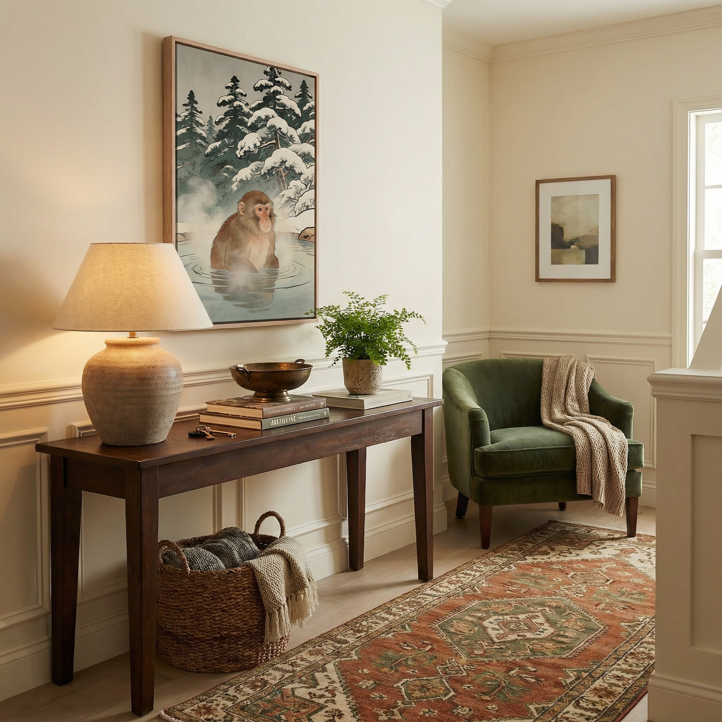 Snow monkey wall art in entryway above console table with warm decor