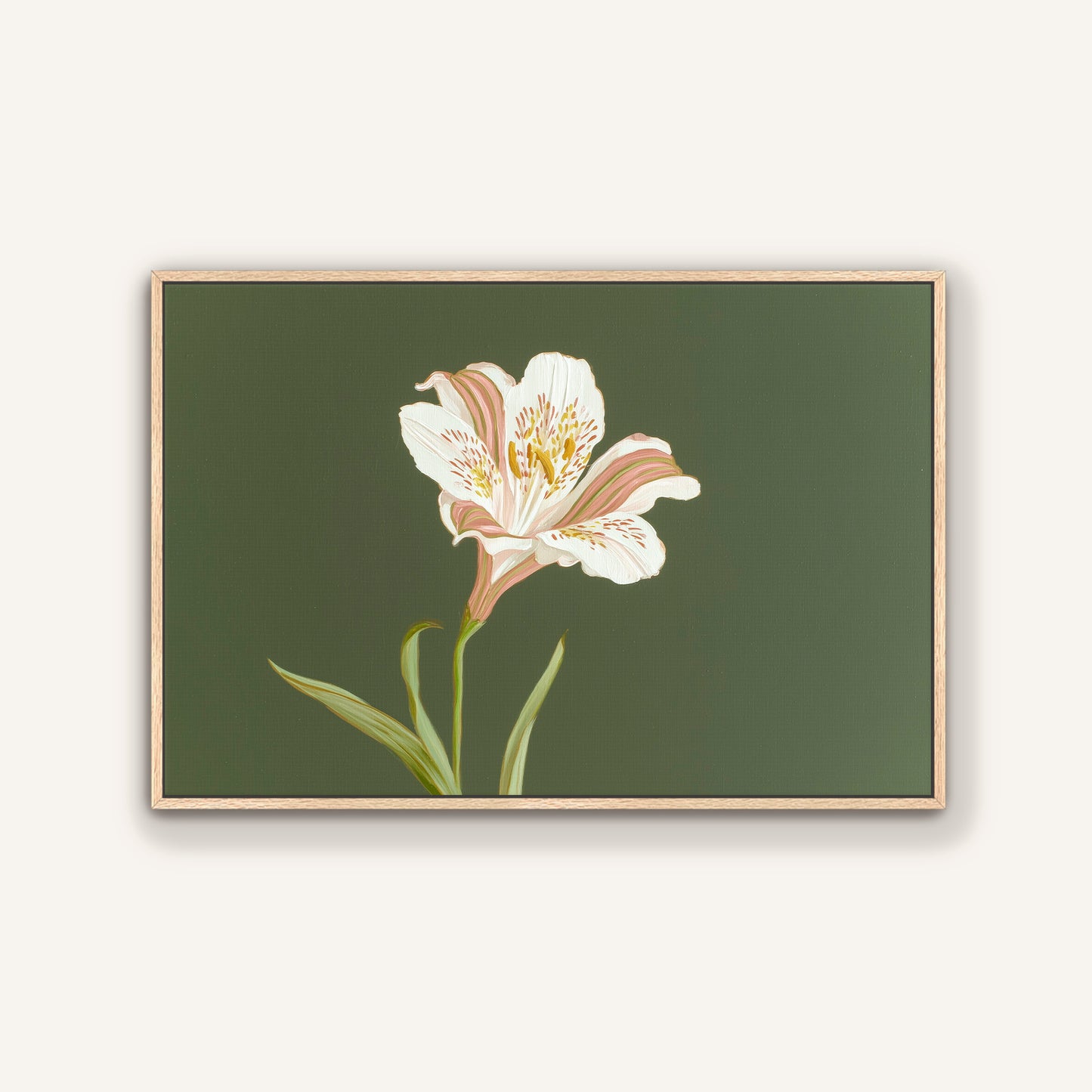 White lily botanical canvas painting in natural oak floating frame against a neutral wall